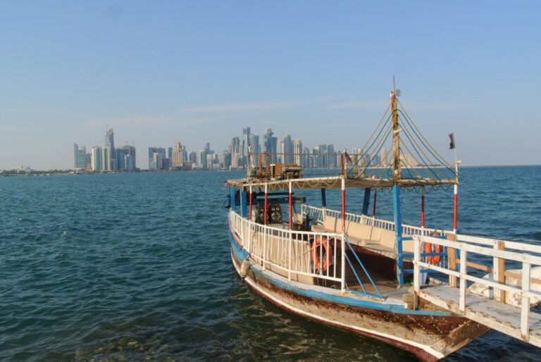 Wooden boat with Doha skyline