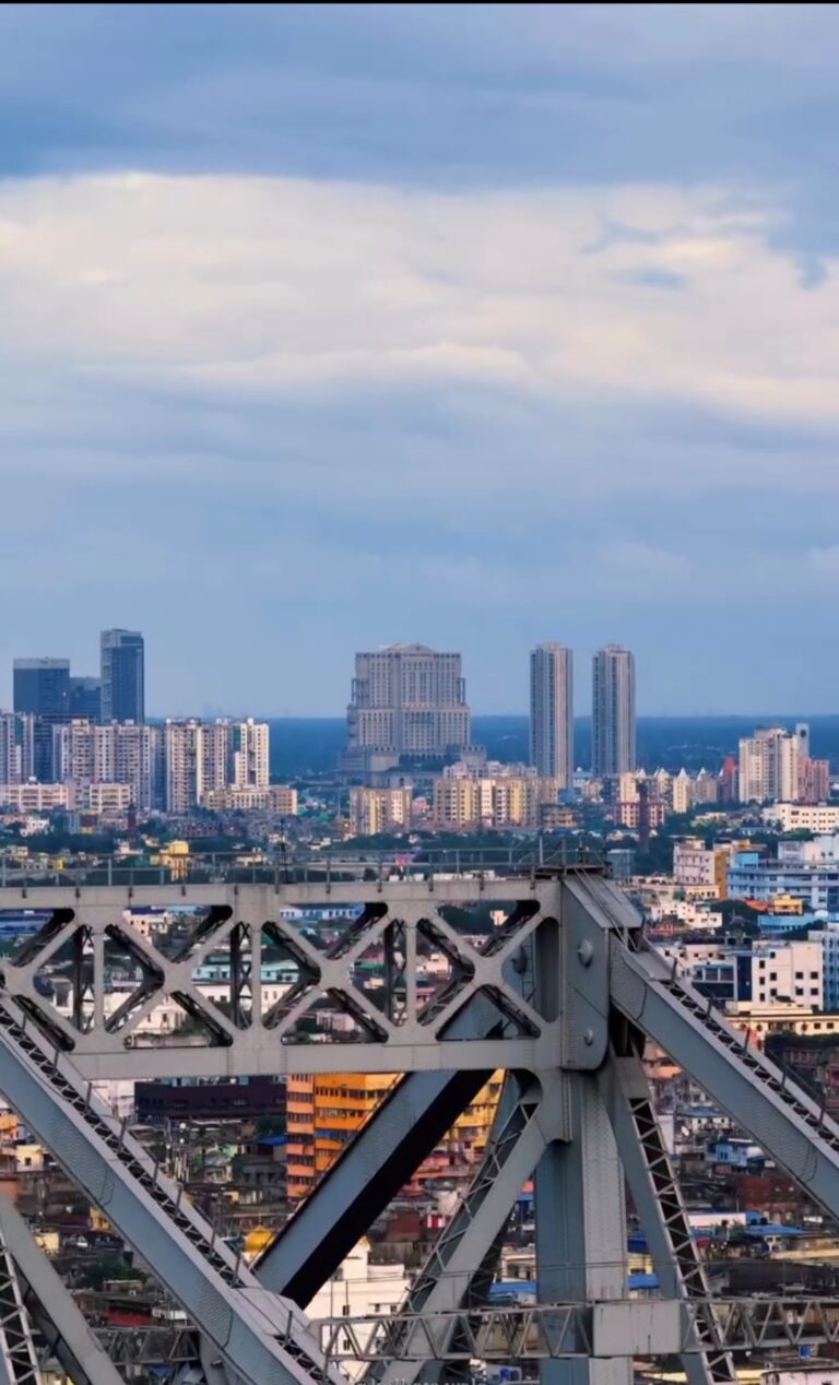 Kolkata skyline through Howrah Bridge