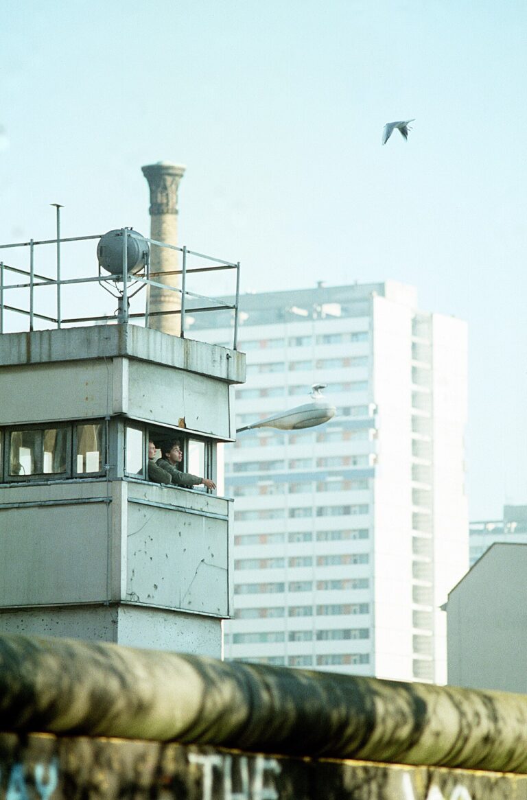 East German guards feed the birds from their post at the Berlin Wall near Checkpoint Charlie. DF ST 91