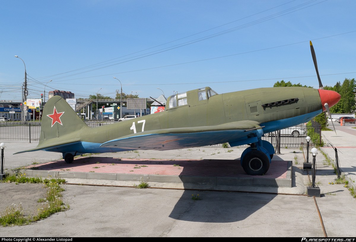 Right-side view of green Ilyushin Il-10 number 17 displayed outdoors.