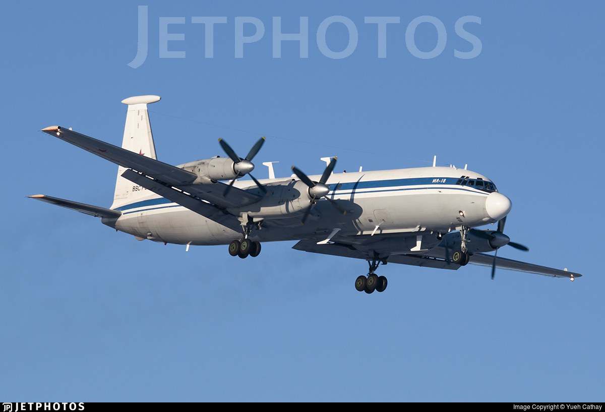 White and grey Ilyushin Il-22M on approach with landing gear down and JetPhotos watermark.