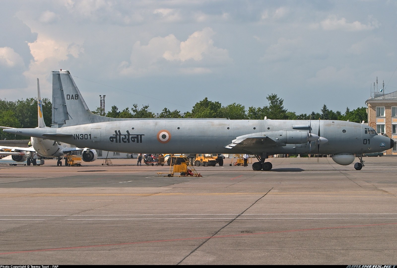 Indian Navy Ilyushin Il-38 IN301 parked on an airfield ramp.