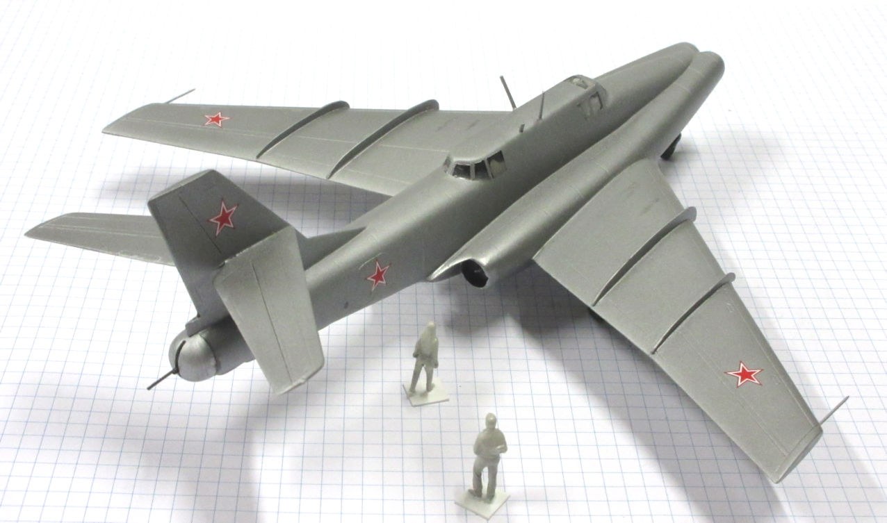 Grey scale model of an Ilyushin Il-40 with red star markings shown from above.