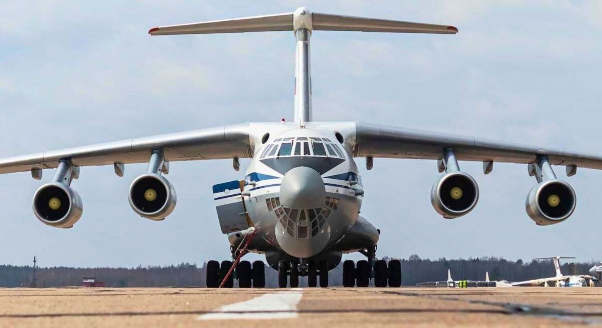 Front view of an Ilyushin Il-78 on a runway with ladder at the nose.