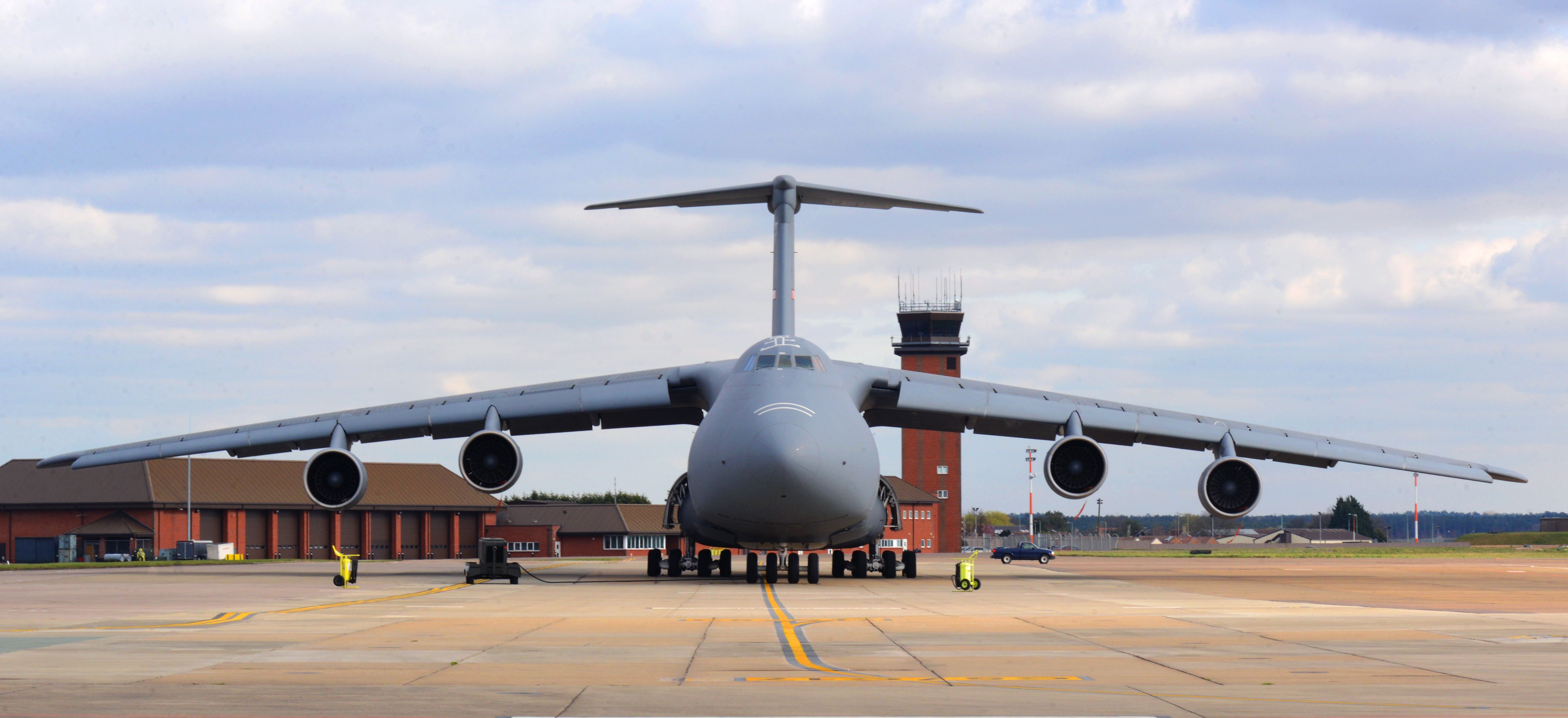 Front view of a U.S. Air Force C-5 Galaxy parked on an airfield ramp.