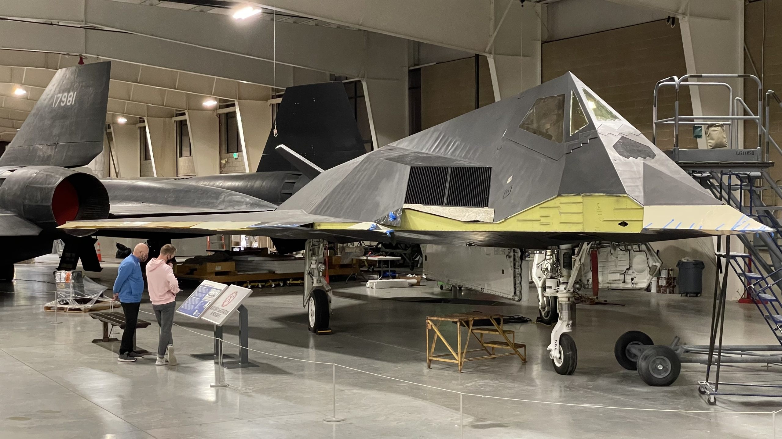F-117 Nighthawk displayed indoors with landing gear down.