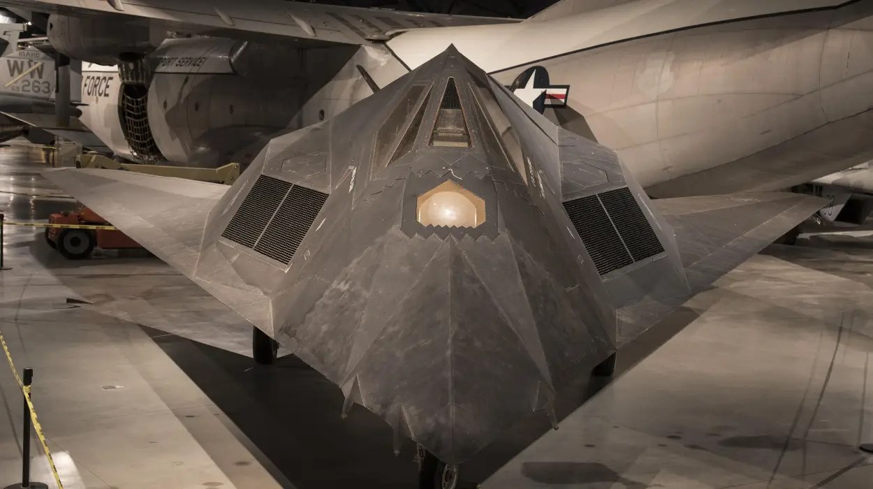 F-117 Nighthawk viewed from the nose inside a museum.