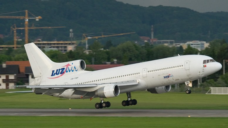 Luzair Lockheed L-1011 TriStar touching down on a runway.