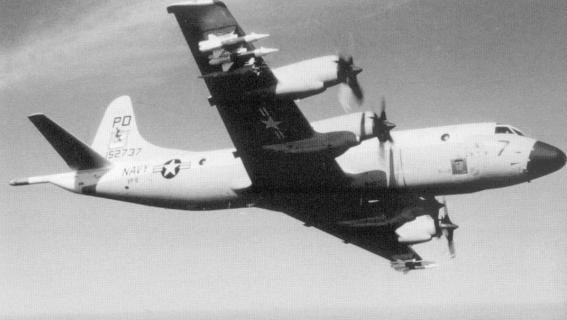 Black-and-white view of a Navy P-3 Orion banking with all four propellers visible.