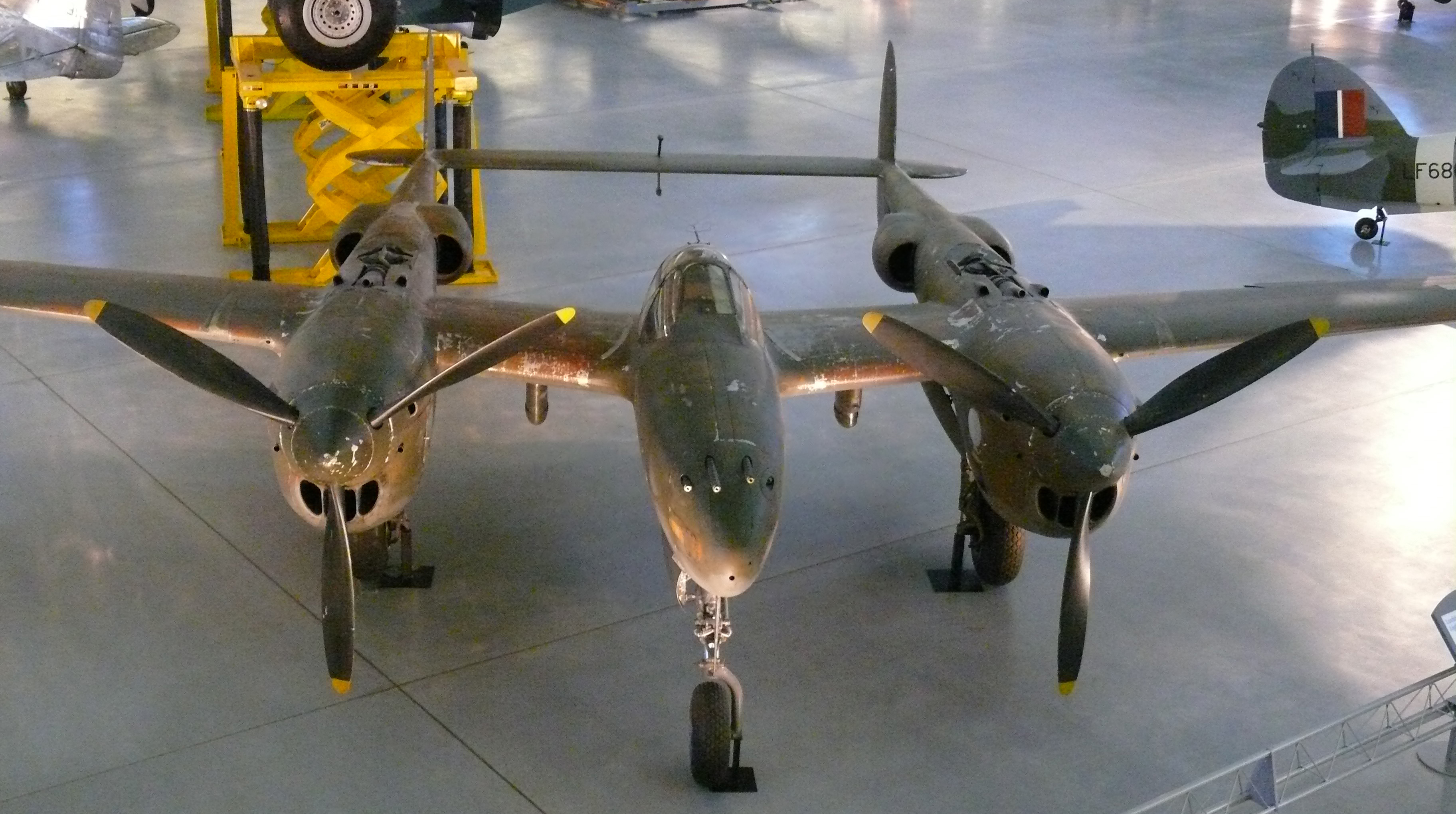 Lockheed P-38 Lightning displayed at the Steven F. Udvar-Hazy Center, showing the aircraft in museum-preserved form.