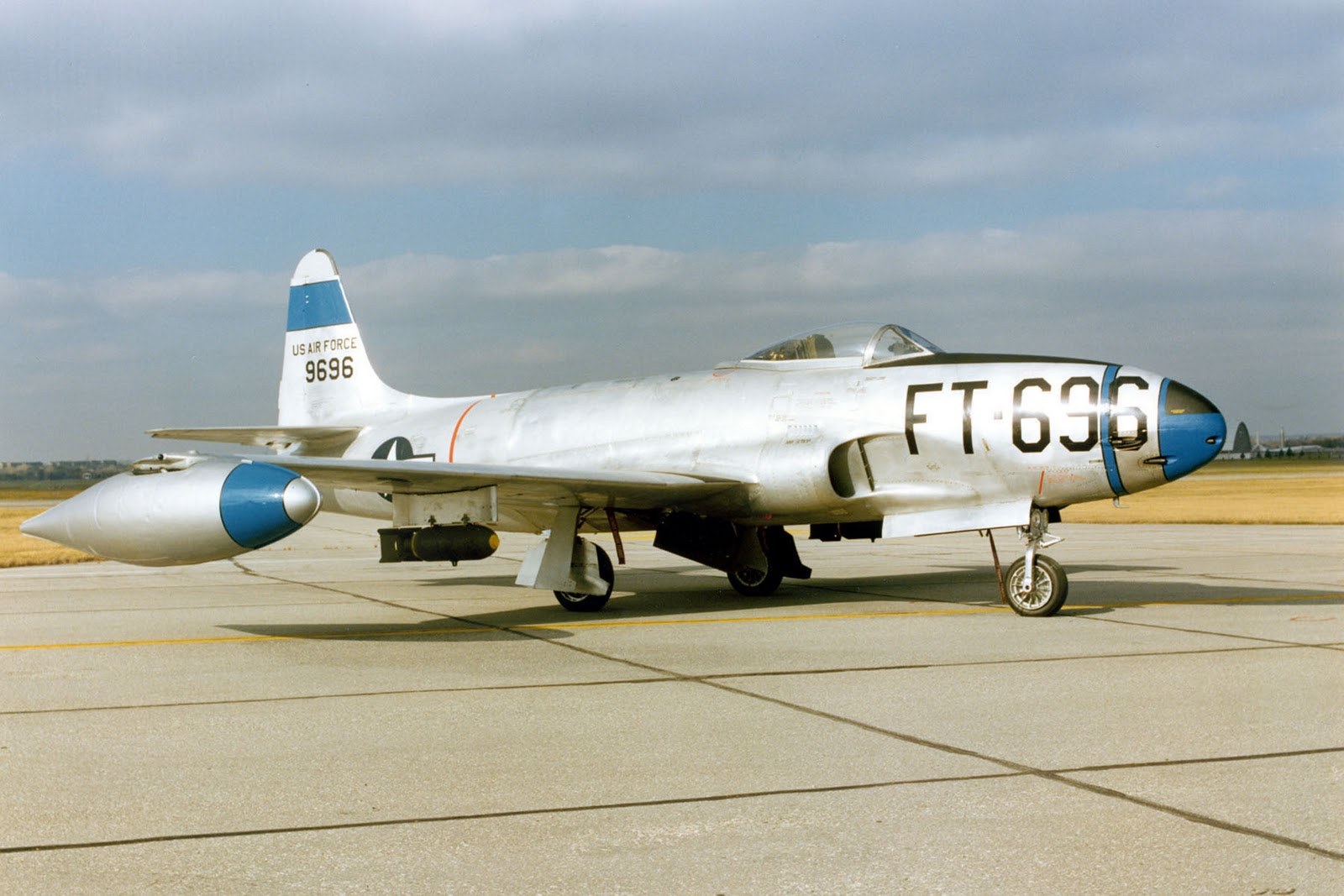 P-80 Shooting Star FT-636 parked on a concrete ramp with blue nose and tip tanks.