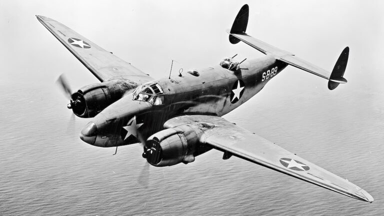 Black-and-white view of PV-1 Ventura 5299 banking in flight.