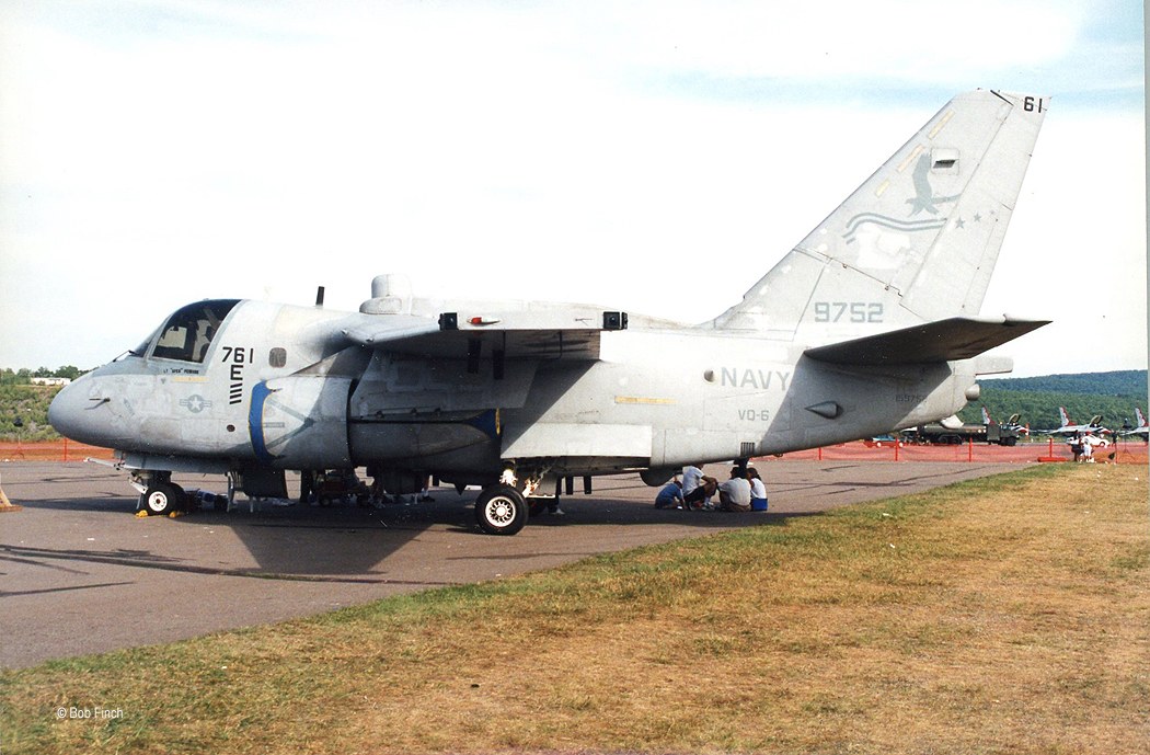 Navy S-3 Viking 9752 parked on a ramp with people near the aircraft.