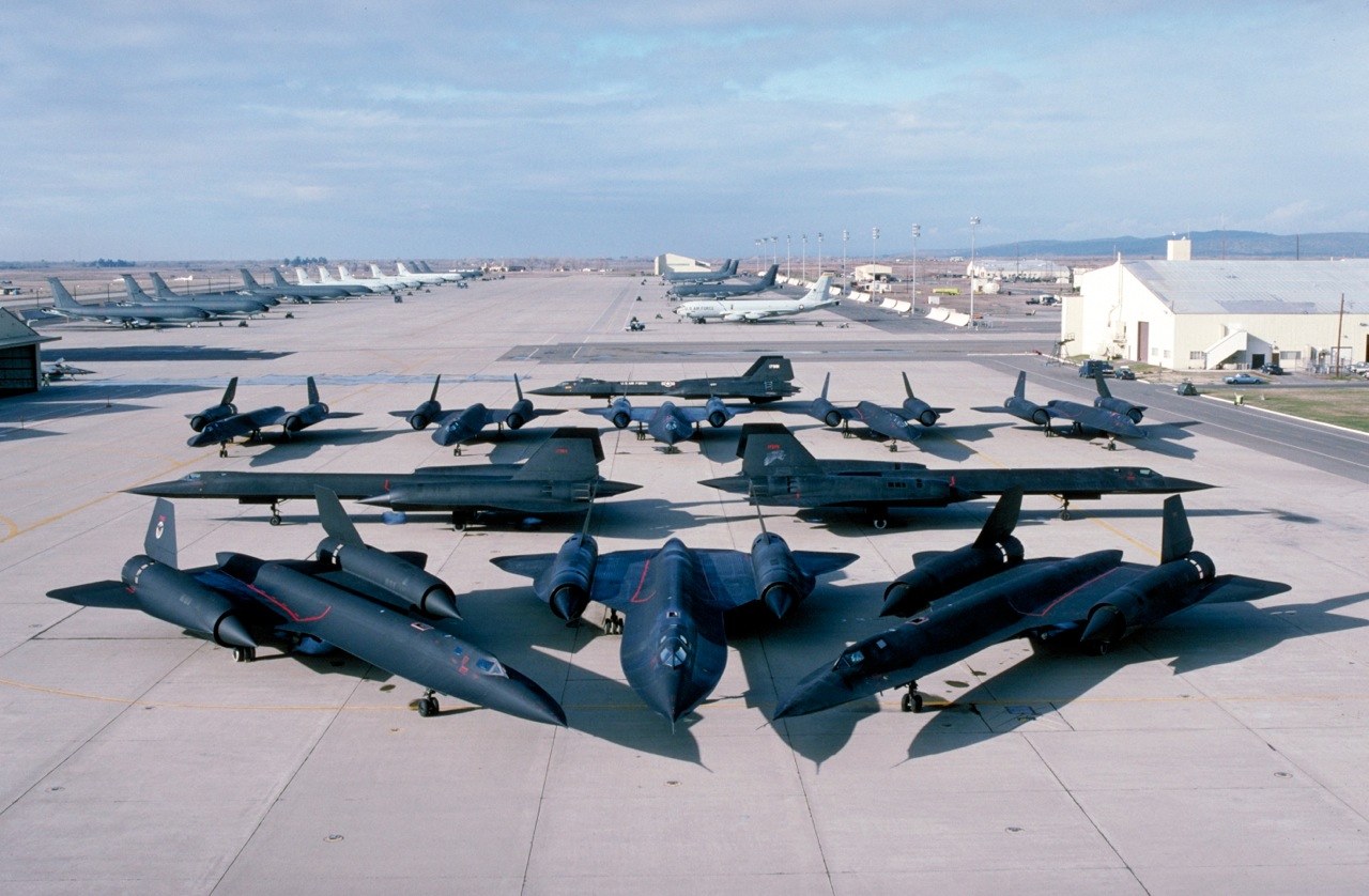 Multiple SR-71 Blackbirds arranged on a concrete ramp.