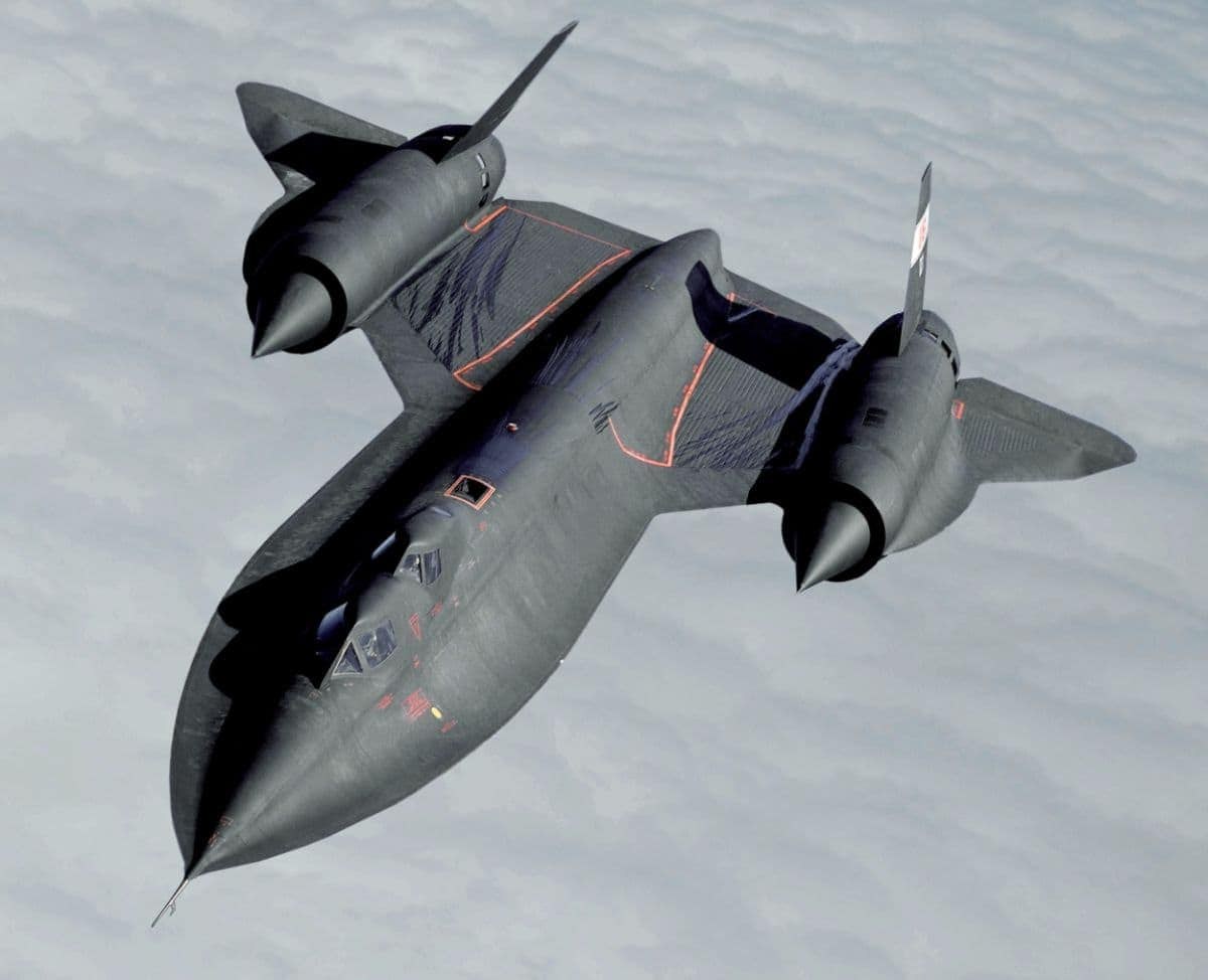 SR-71 Blackbird banking above a cloud layer.