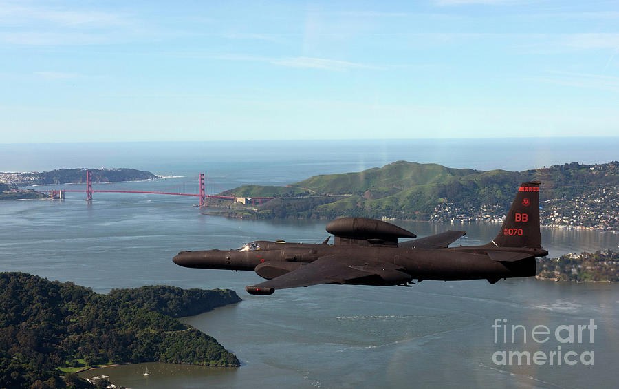 Black U-2 flying near the Golden Gate Bridge and San Francisco Bay.