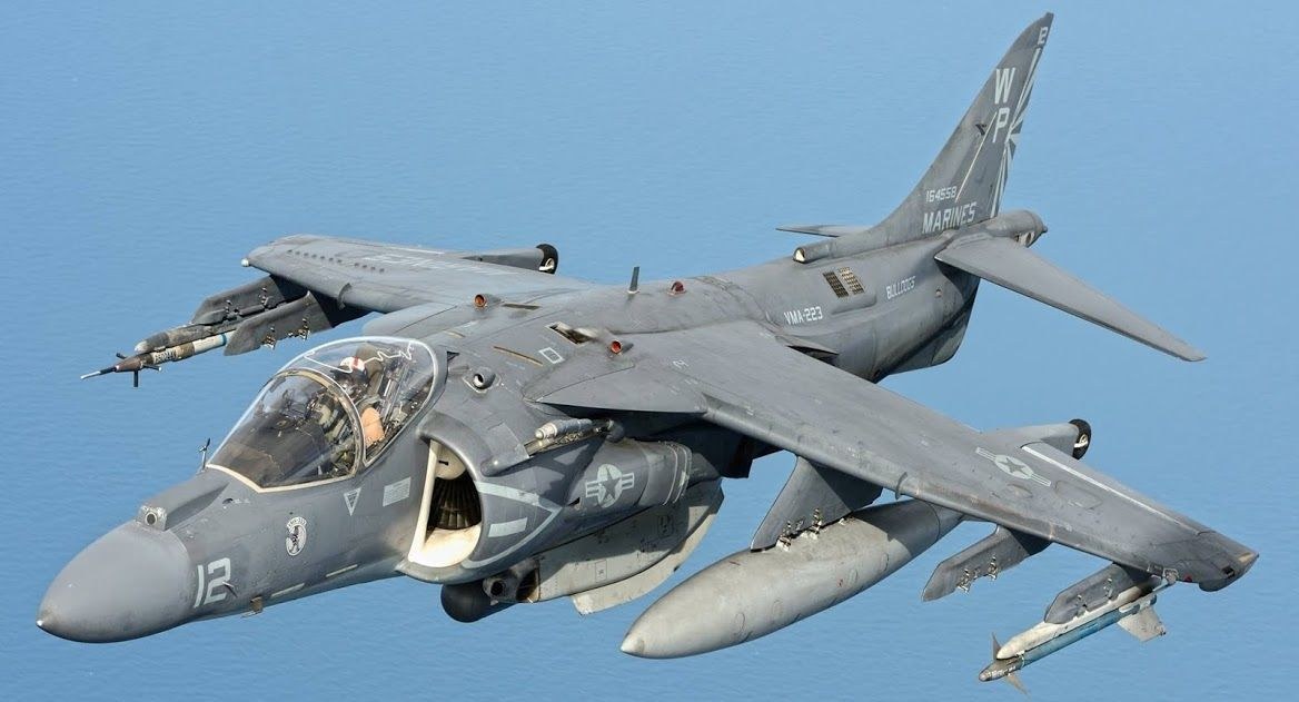 AV-8B Harrier II 12 banking in flight with external tanks and stores.