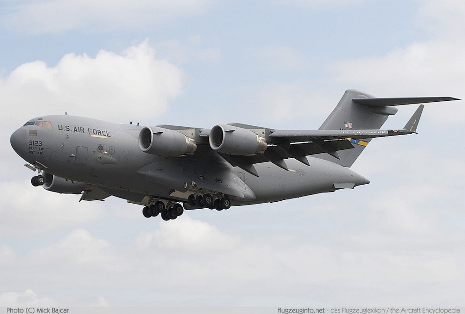U.S. Air Force C-17 Globemaster III 50152 flying with landing gear down.