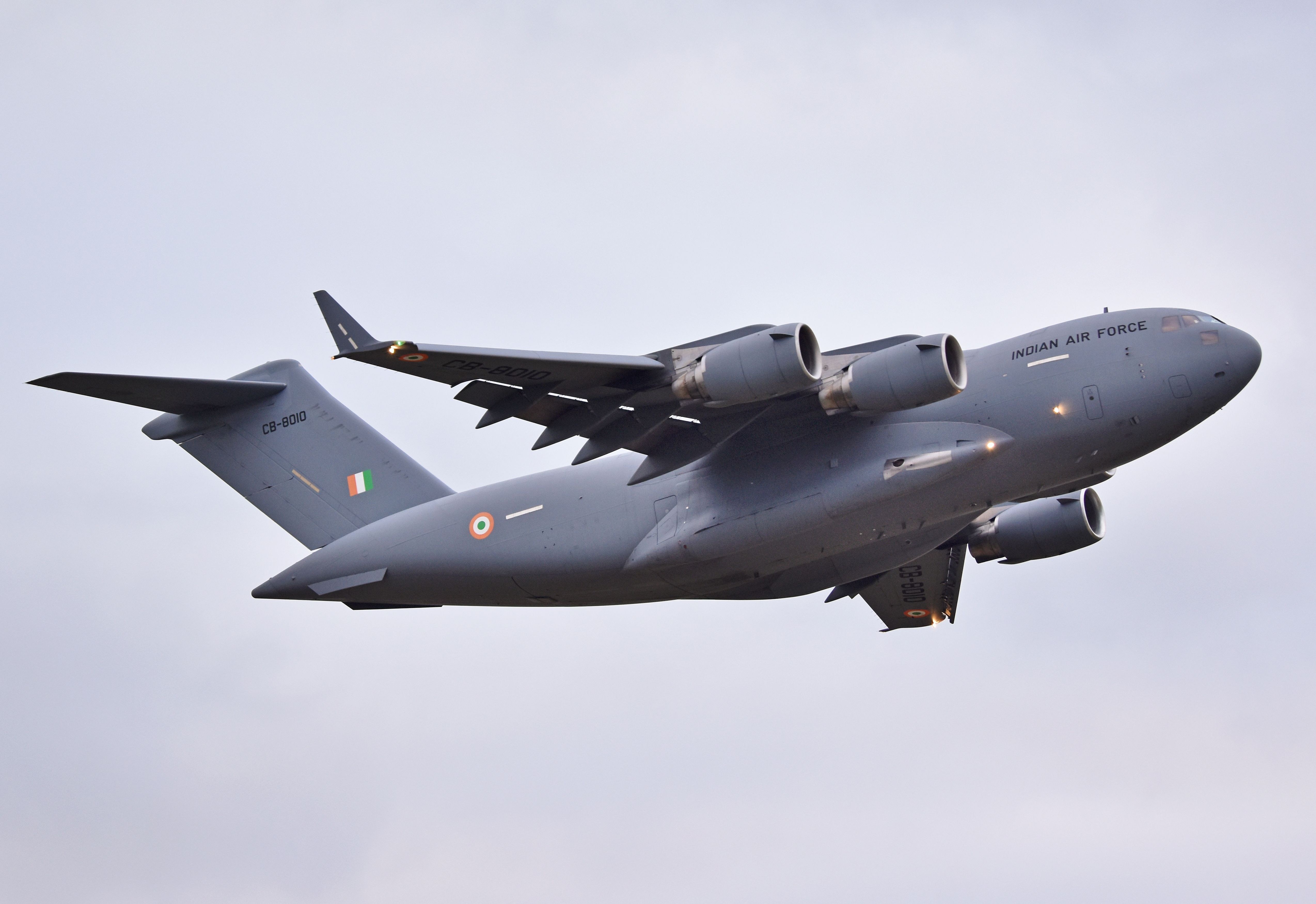 Indian Air Force C-17 Globemaster III climbing with landing gear partly extended.