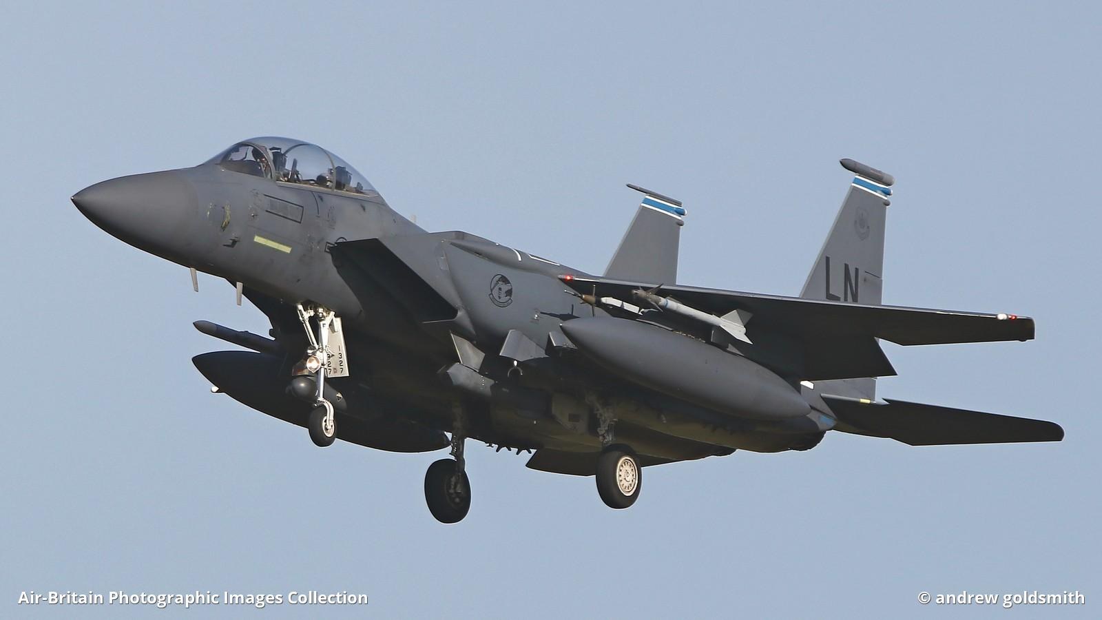 F-15E Strike Eagle airborne with landing gear down and LN markings on the tail.