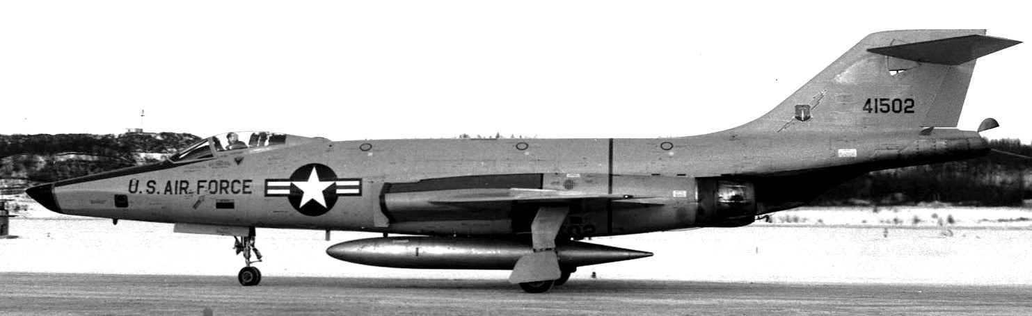 Black-and-white side view of U.S. Air Force F-101 Voodoo 41502 on a runway with landing gear down.