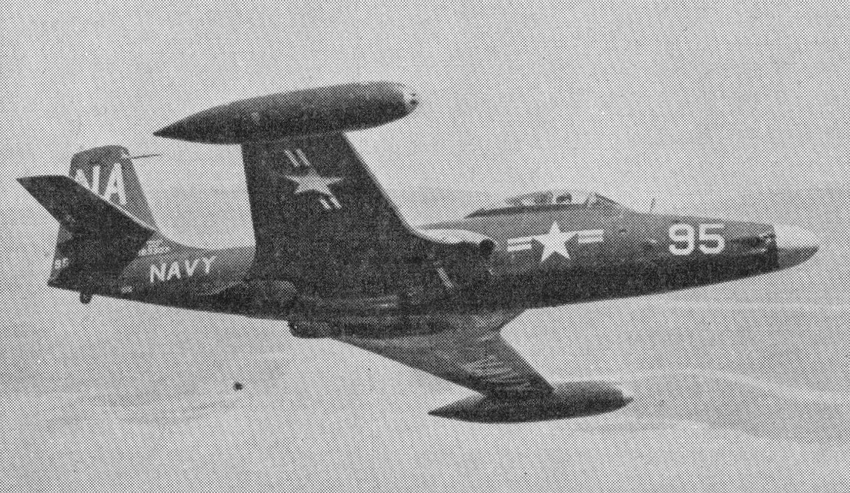 Black-and-white view of a U.S. Navy F2H Banshee numbered 95 flying with gear retracted.