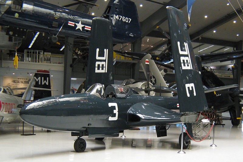 Dark blue McDonnell FH Phantom numbered 3 displayed inside a museum hangar.
