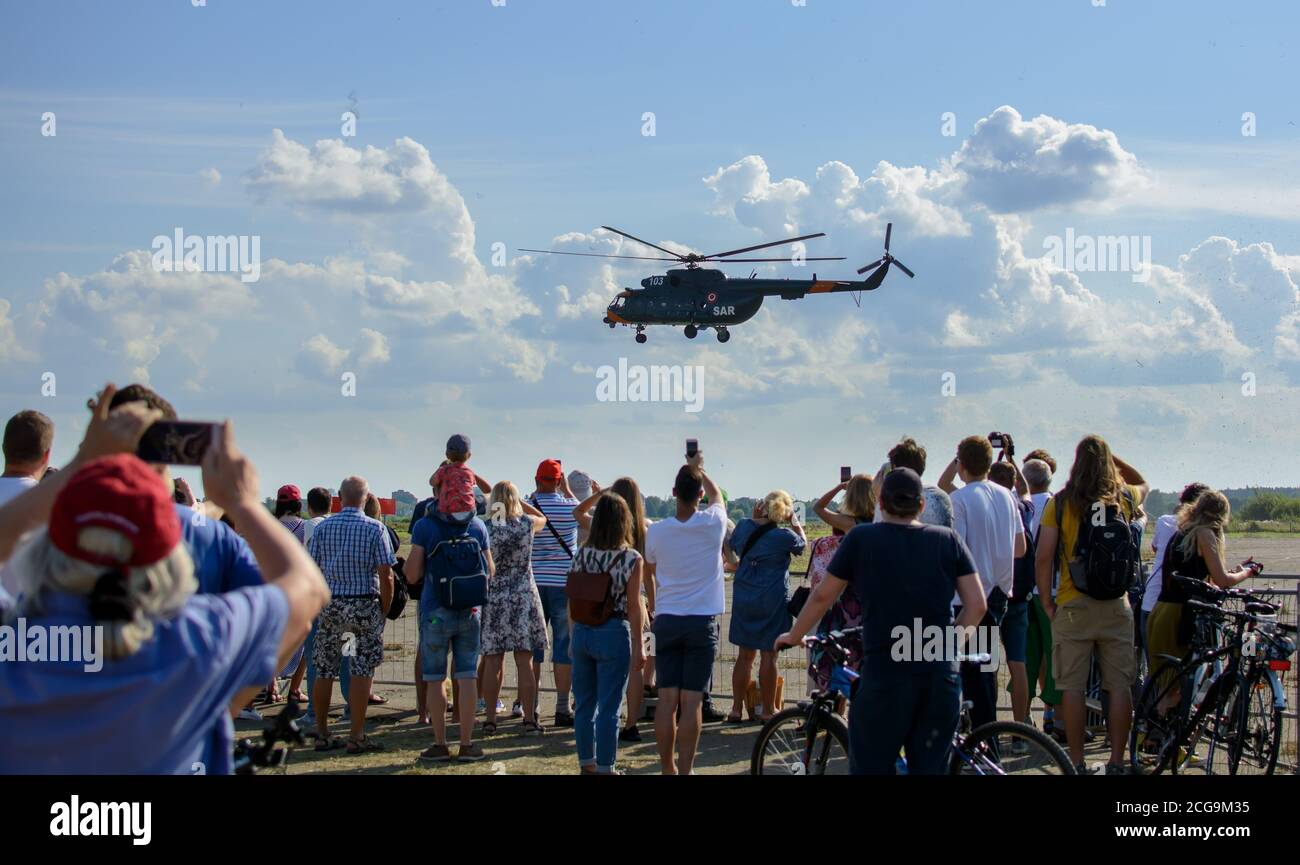 Mil Mi-17 - People are watching Mil Mi-17 helicopter taking off at Spilves Aviation