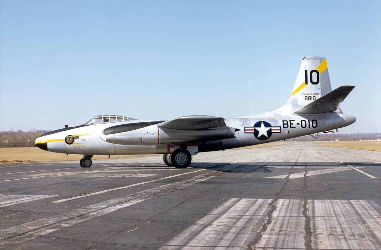 B-45 Tornado 0-80010 parked side-on on a runway with landing gear down.
