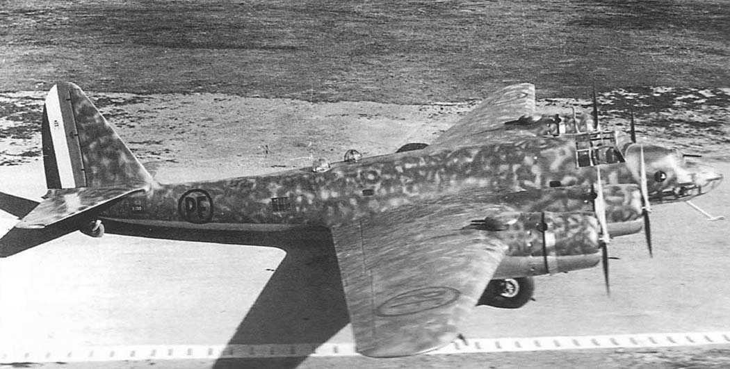 Piaggio P.108 heavy bomber in flight over coastline
