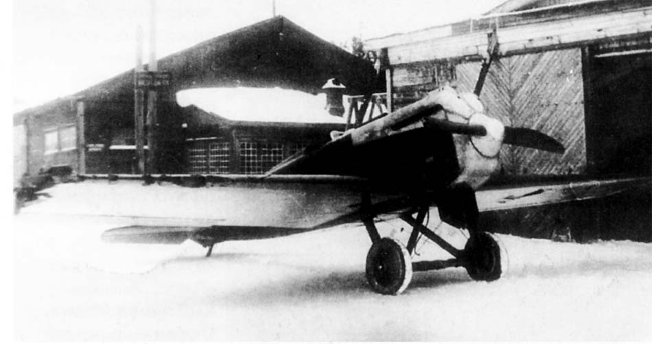 Polikarpov I-1 front quarter view near hangar