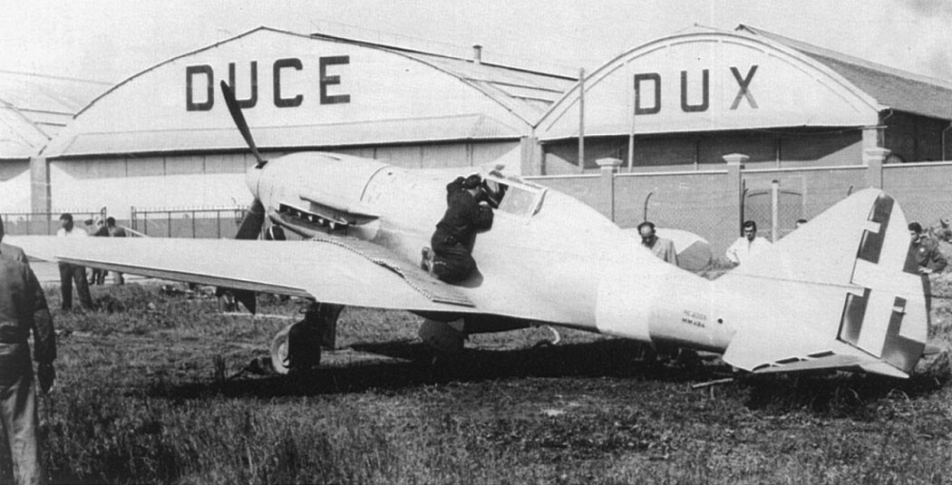 Reggiane Re.2005 Sagittario parked by a hangar