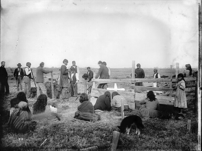 Paiute funeral scene with dog in foreground