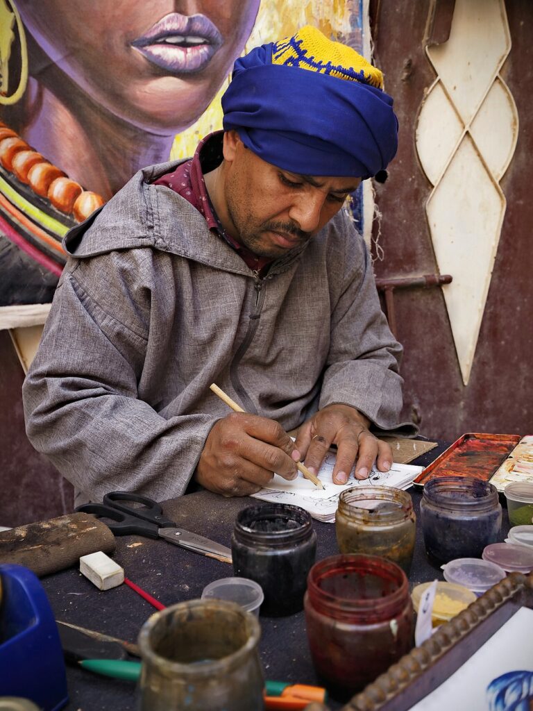 Berber painter at work in Ouarzazate