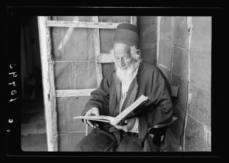 Rabbi reading Torah
