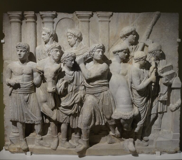 Heavily restored architectural relief depicting a scene of a sacrificial processio