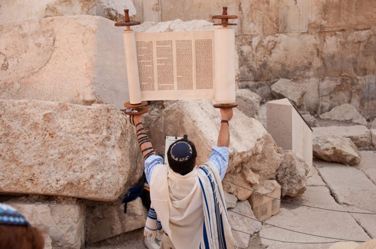 Rabbi holding a Torah scroll