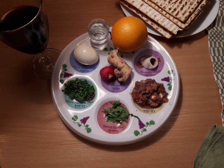 Passover seder plate with wine and matzot