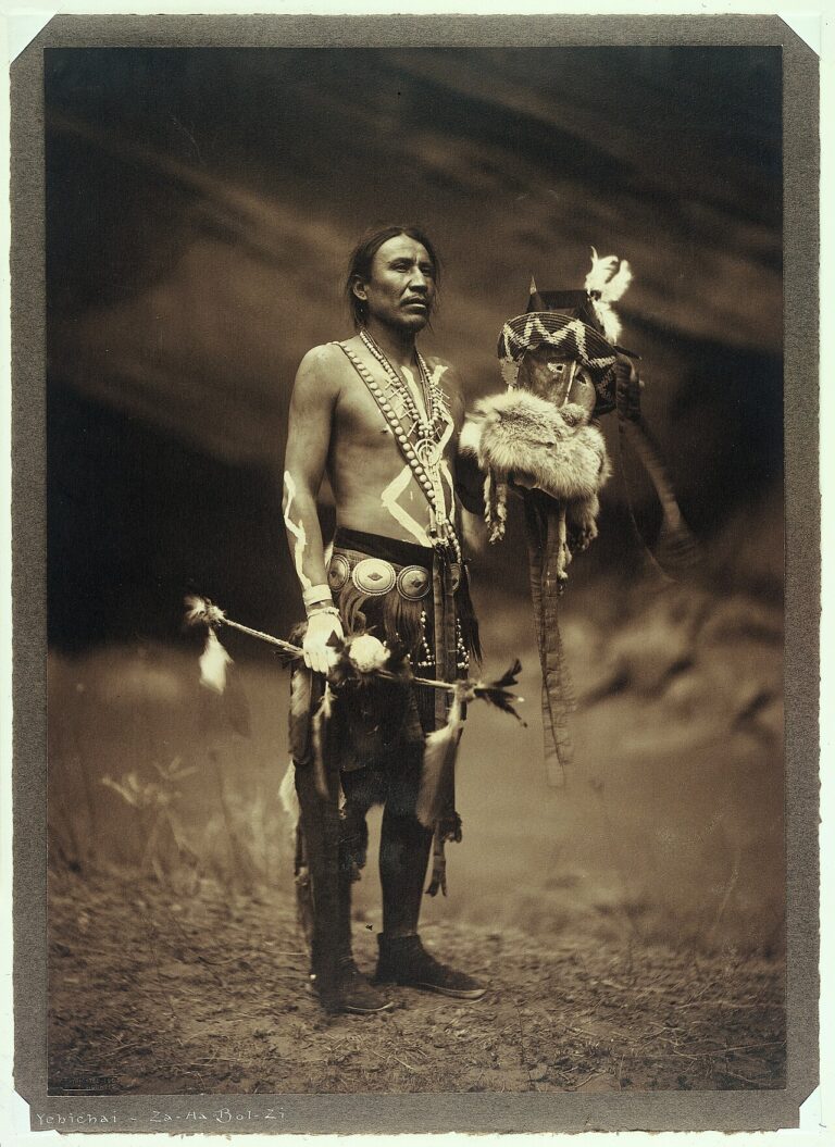 A Navajo man in ceremonial dress representing the Yebichai g