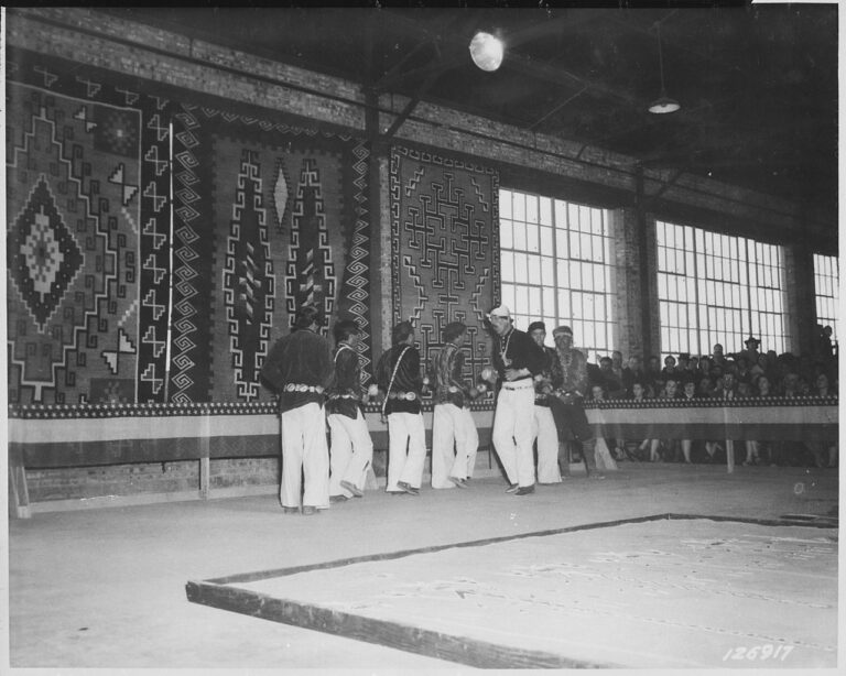 Medicine Man Charlie Turquoise (third from right) leads a group of Navajo dancers