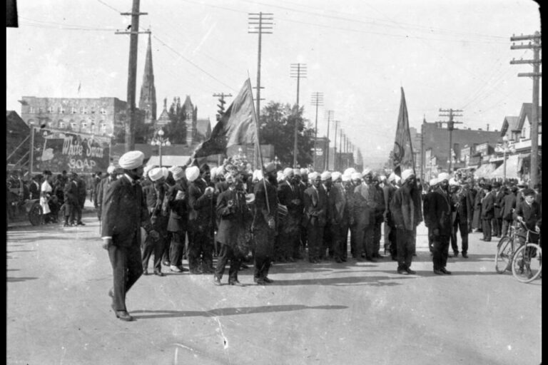 Photograph of a Canadian-Sikh community procession near the intersection of Yates