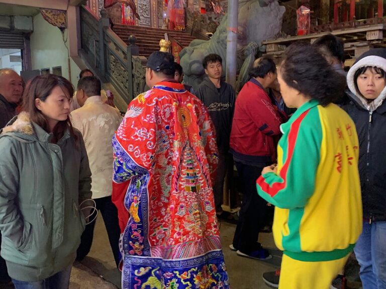 A Taoist priest in crowd at the Yuanjiao Festival of Nanliao Fumei Temple