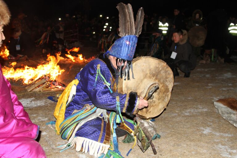 Mongolian shaman performing a fire ritual