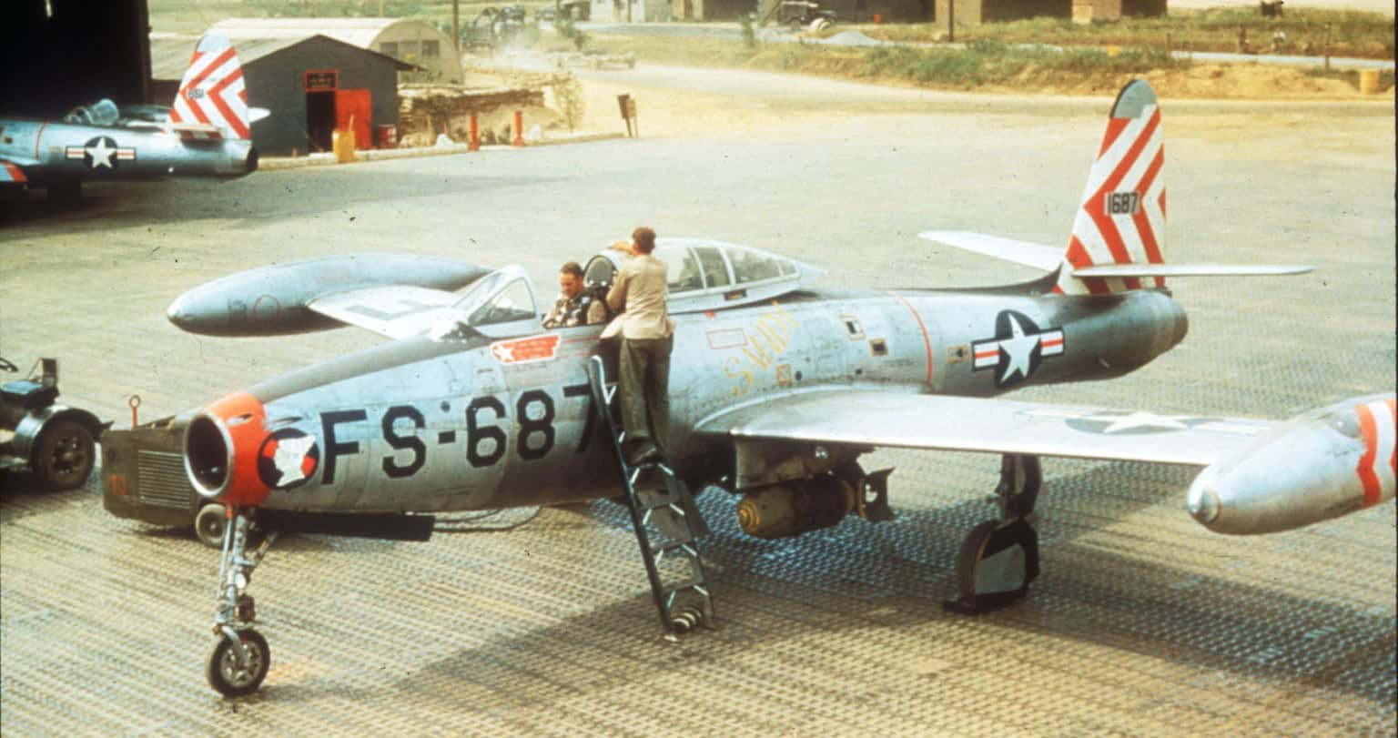 Republic F-84 Thunderjet - A U.S. Air Force F-84 crew chief cleans the canopy as the pilot straps in before a mission. Republic F-84 Thunderjet ? History, Technical...