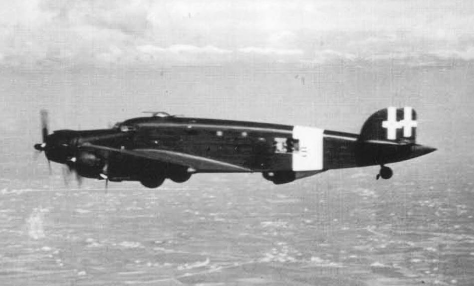 Savoia-Marchetti SM.84 in flight over water