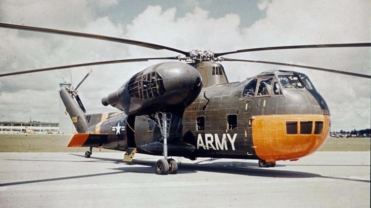U.S. Army CH-37 Mojave parked on a ramp with orange nose panels.