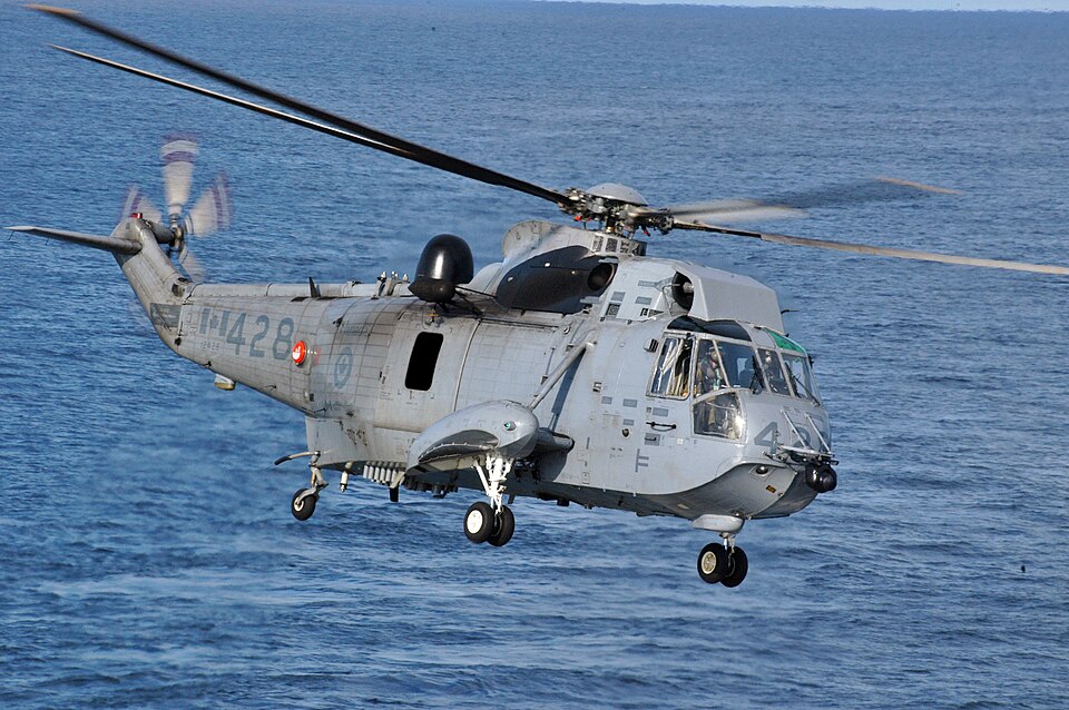 Sikorsky CH-124 Sea King helicopter flying over water, showing the naval helicopter type used for maritime operations.