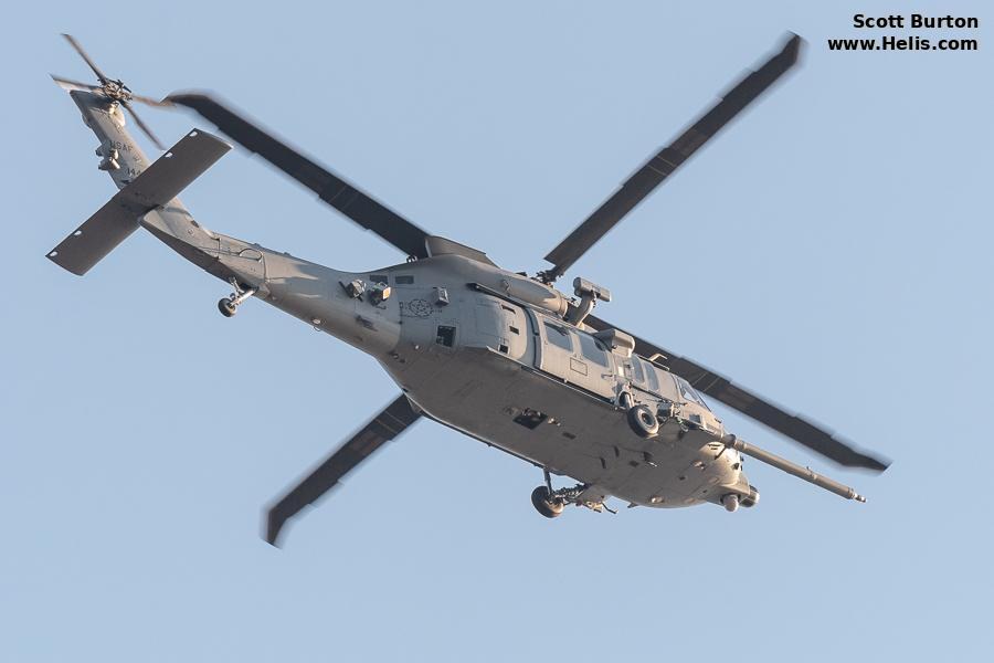 Sikorsky HH-60W Jolly Green II flying overhead in an underside view.