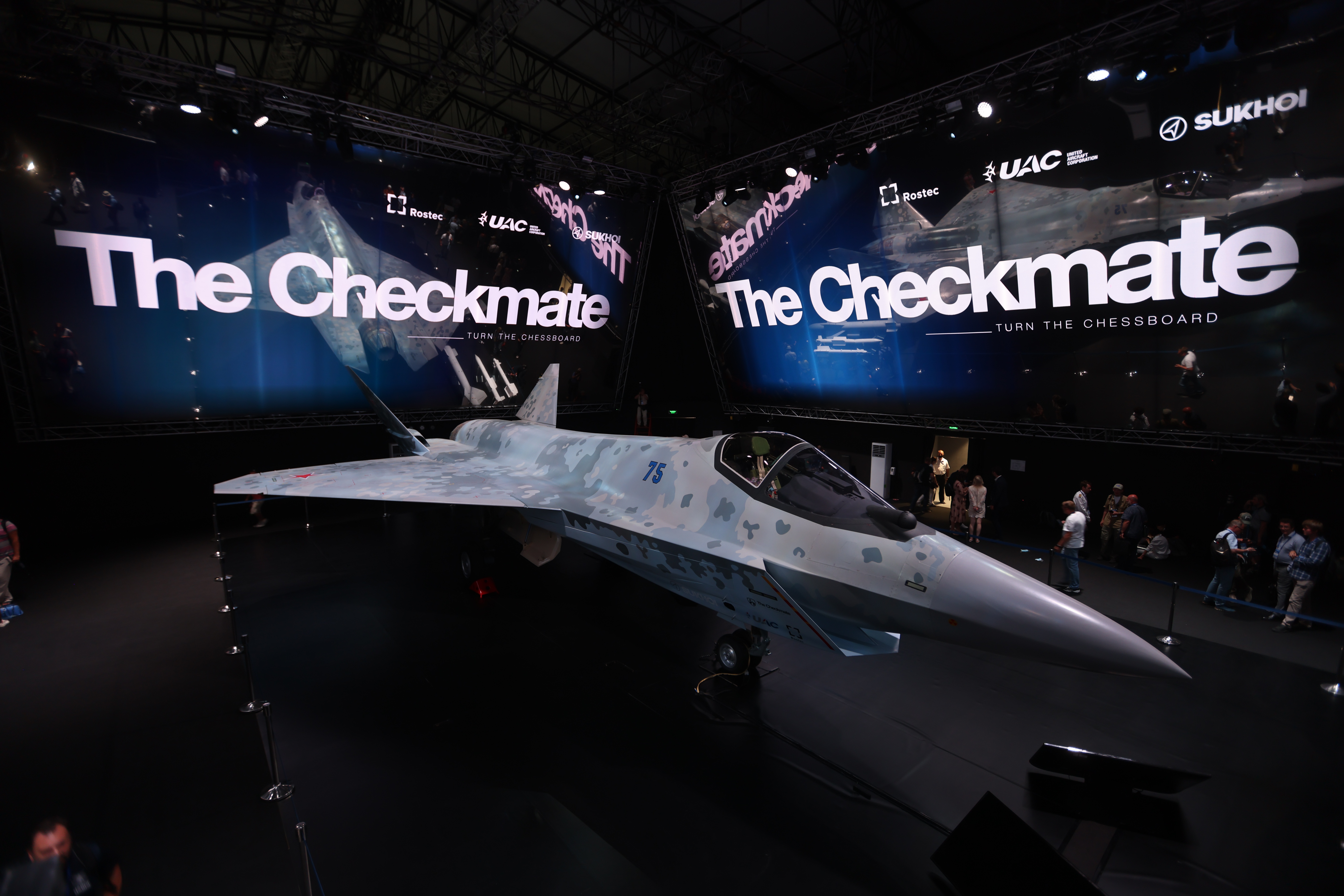 Sukhoi Su-75 Checkmate prototype display at a UAC exhibition stand.