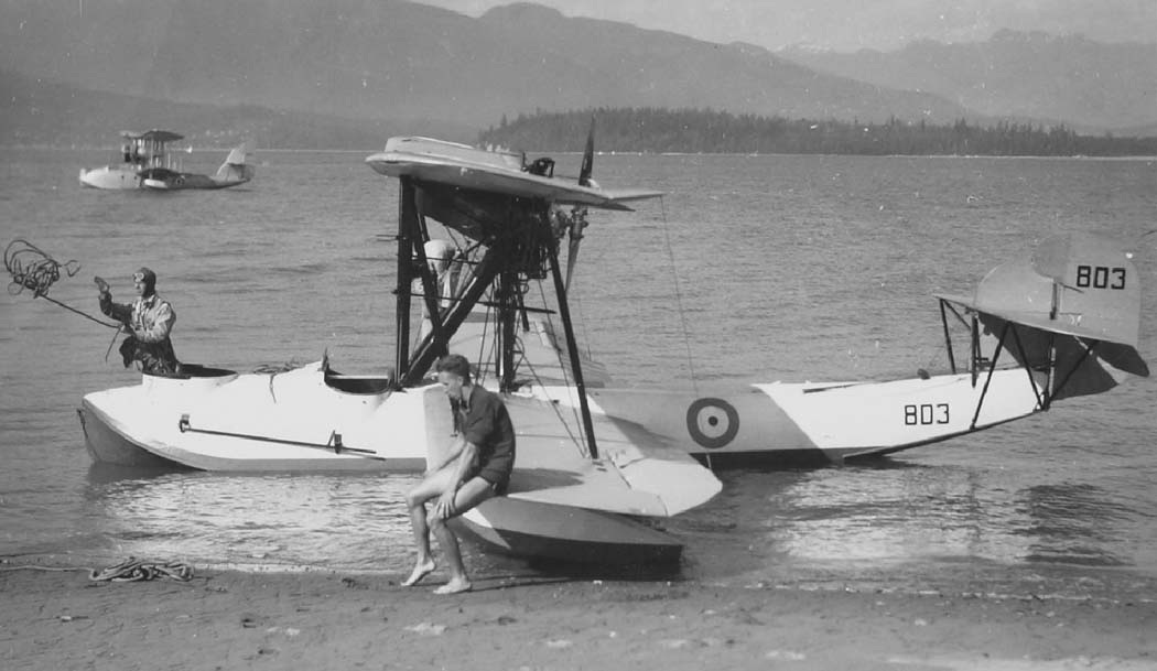 Vickers Vedette flying boat with crew beside the float